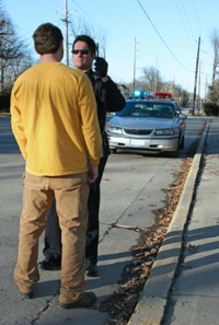 Police conducting a DUI test for a drunk driver