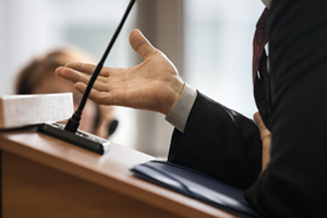 A man in a suit is giving a speech