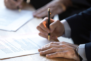 A man signing a document