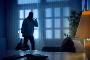 A person standing in front of a lamp