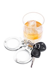 Car key next to a whiskey and a handcuff against a white background