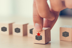 Businessman Holding Wooden Cubes