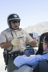 Traffic cop checking driving license