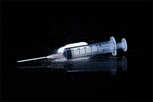 Drug syringe and cooked heroin